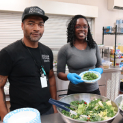 Light House staff and volunteer in community kitchen